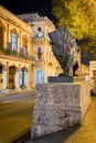 Night scene in Old Havana with a famous bronze lion considered a symbol of the city