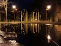 Night scene after rain - lantern lights and puddle Royalty Free Stock Photo