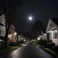 the night scene shows two homes on a quiet street as seen from a neighborhood street