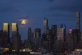 Night Scene: Super Full Moon and City Lights Royalty Free Stock Photo