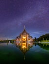 Night scene of temple on the background of the starry sky. Buddhist Church Temple. Dharma retreat. Magha puja day Royalty Free Stock Photo