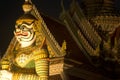 Night scene Thai Giant guardian at front entrance of the `Ordination Hall` in Wat Arun Ratchawararam is the most famous Buddhist t