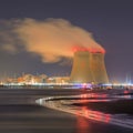 Night scene with view on riverbank with nuclear reactor Doel, Port of Antwerp, Belgium