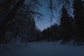 Night scene in winter, starry sky and frozen river Valge, Estonian nature