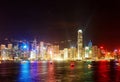 Night scenery of Hong Kong with a majestic skyline of crowded skyscrapers by Victoria Harbour Royalty Free Stock Photo