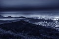 Night scenery of panorama of skyline of Hong Kong city in fog Royalty Free Stock Photo