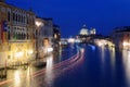 Night scenery of romantic Venice in blue twilight, with light trails of ferries, boats & ships cruising on the Grand Canal