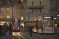 Night scenes from the center of Bern with people on the street, tourist sights and legendary trams or buses.