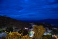 Night sea coast hills with olive trees, Greece Royalty Free Stock Photo
