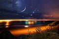 Night at sea starry sky and moon on dramatic clouds sea water wave and stones on horizon blurred city light Royalty Free Stock Photo