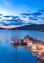 Night seascape with big white catamaran yacht boat, vacation destination Royalty Free Stock Photo