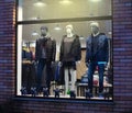 Night shopwindow with dressed mannequins