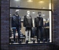 Night shopwindow with dressed mannequins Royalty Free Stock Photo