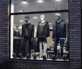 Night shopwindow with dressed mannequins Royalty Free Stock Photo