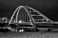 Night shot of arched bridge