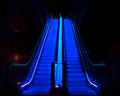 Night shot of a blue illuminated escalator, motion blur