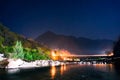 Night shot of bridge mountains and water Royalty Free Stock Photo