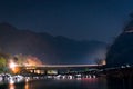 Night shot of bridge mountains and water Royalty Free Stock Photo