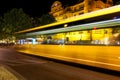 Night shot of a bus with ghosting effects due to the long exposure time on an intersection in downtown Berlin Royalty Free Stock Photo
