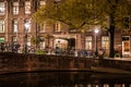 Night shot of the city, many bicycles on the bridge on Amsterdam canal, Netherlands Royalty Free Stock Photo