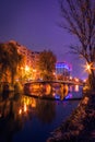 Night shot cityscape on the river with a bridge in the autumn wi