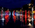 Night shot of colorfully lit water fountains on the Promenade du Paillon in Nice, France