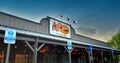 A Night Shot of a Cracker Barrel Restaurant Logo on the Front Entrance of the Building