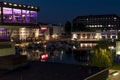 Night shot of a harbor on the Teltow Canal in Berlin-Tempelhof with boats, old warehouses and cranes