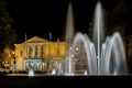 Opera from Halle Saale in Germany with fountains in front of it at night