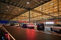 Night shot of the reception building at BER Berlin-Brandenburg Airport with the `Kiss and Fly` parking zone