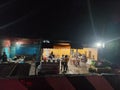 night shot of road side business, small eateries on a highway in Jammu