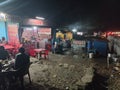 night shot of road side business, small eateries on a highway in Jammu
