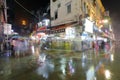 Night sight of old street in the rain, pedestrian and tourist