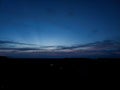 Night sky background, sunset wallpaper, nature photography, dark clouds in blue sky over the city Royalty Free Stock Photo