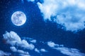 Night sky with bright full moon and cloudy, serenity blue nature Royalty Free Stock Photo