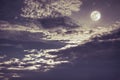 Night sky with bright full moon and dark cloud, serenity nature background Royalty Free Stock Photo