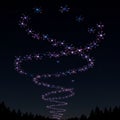A night sky displays a mesmerizing spiral formation of illuminated drones. These Royalty Free Stock Photo