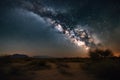 night sky filled with twinkling stars and the milky way over desert landscape Royalty Free Stock Photo
