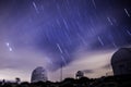 Night sky full of stars in a astrophysical center with telescopes.