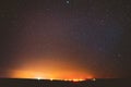 Night Sky Glowing Stars Background Backdrop. Colorful Sky Gradient. Sunset, Sunrise And Town Lights At Horizon Royalty Free Stock Photo