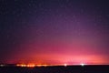 Night Sky Glowing Stars Background Backdrop. Colorful Sky Gradient. Sunset, Sunrise And Town Lights At Horizon Royalty Free Stock Photo