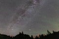 Milky way in the Dolomites forest with a amazing airglow in summer Royalty Free Stock Photo