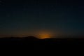 Night sky with light pollution above dunes Erg Chebbi near Merzouga, Morocco Royalty Free Stock Photo