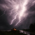 Lightning Thunderstorm Over A Lone House At Night Generative AI Royalty Free Stock Photo