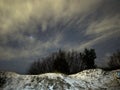 Night sky Lyra constellation stars clouds and snow observing winter landscape Royalty Free Stock Photo