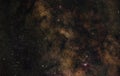 Night sky with milky way near Scutum and Sagittarius constellation, bright M22 globular cluster left side, purple Lagoon and. Royalty Free Stock Photo