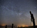 Night sky and milky way stars, Cygnus constellation over sea Royalty Free Stock Photo