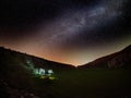 Night sky with milky way and stars, night road illuminated