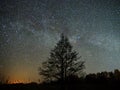 Night sky and milky way stars, Perseus, Cassiopeia over field Royalty Free Stock Photo