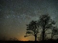 Night sky and milky way stars, Perseus, Cassiopeia over field Royalty Free Stock Photo